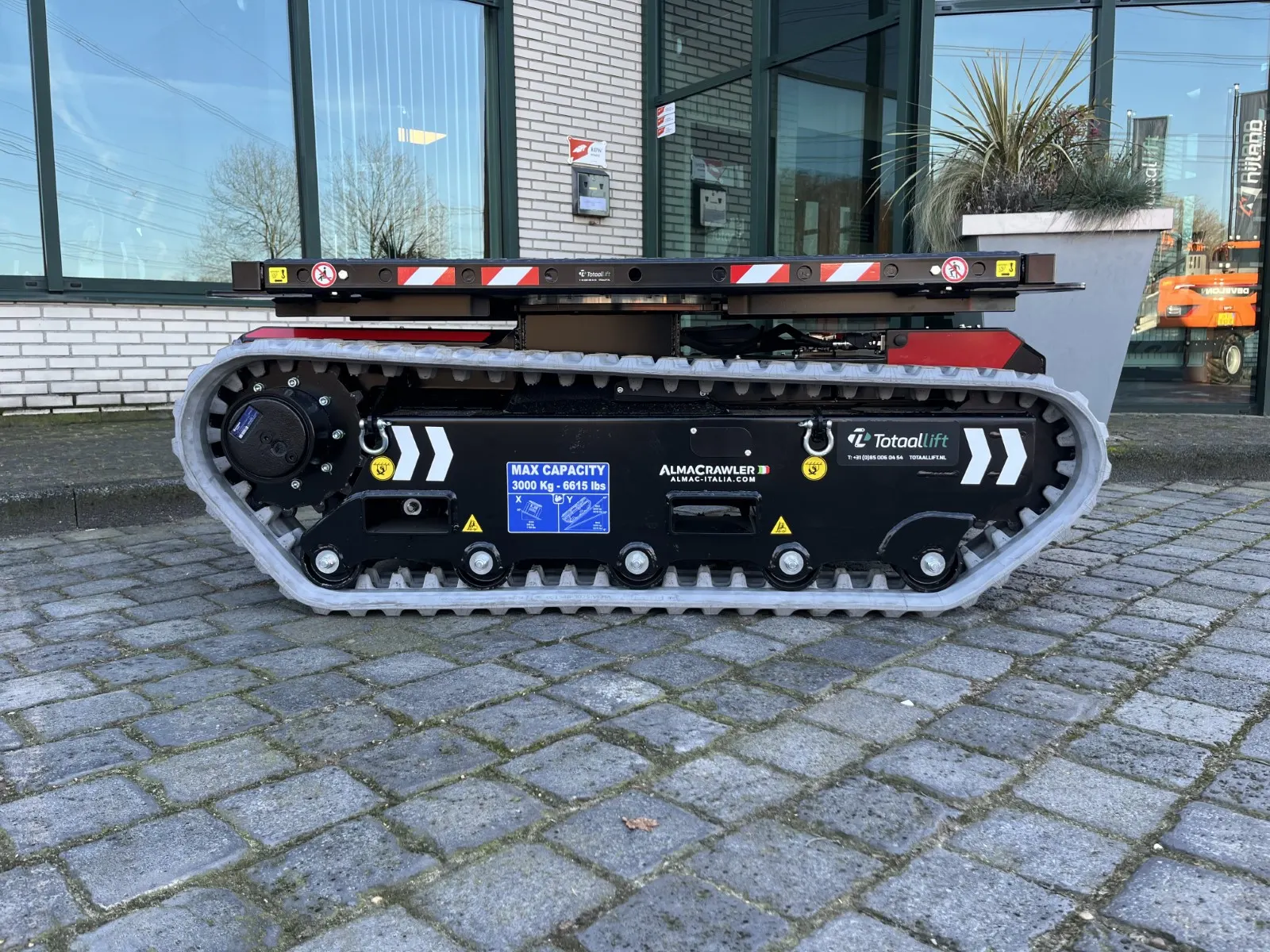 zijkant rups transportcarrier 3 ton